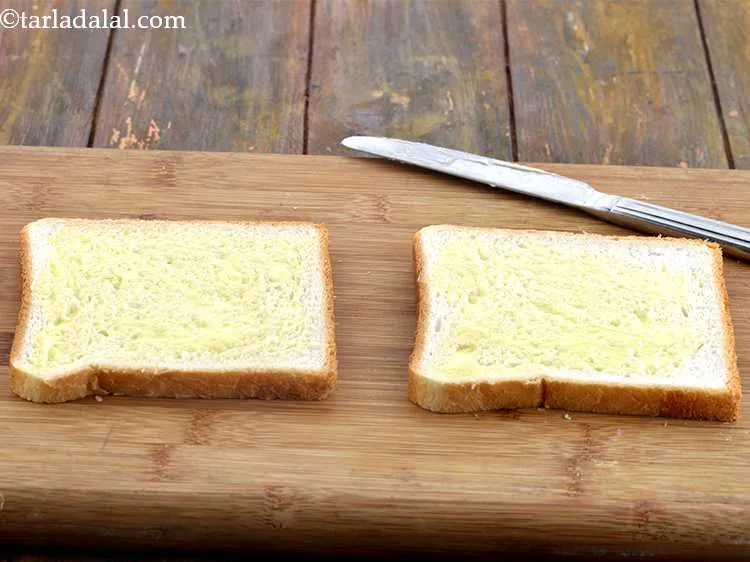 Step 13 – Apply a little butter on each bread slice. We have used &frac12; tsp butter on …