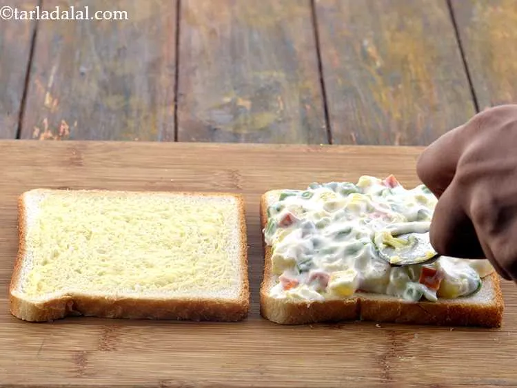 Step 15 – Spread it evenly with the help of a spoon.