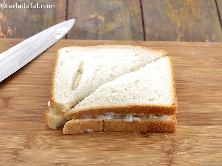 Step 17 – Cut the&nbsp;<strong>Russian salad sandwich | veg Russian salad sandwich | Indian style&nbsp;cold&nbsp;Russian salad sandwich |</strong>&nbsp;diagonally …