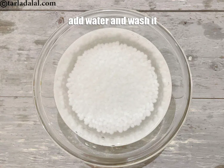 Step 9 – Put sabudana in a glass bowl of water and wash it with your hands. Not …