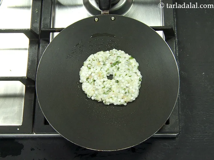 Step 46 – Remove the plastic sheet and place the circle on a hot greased non-stick tava (griddle).