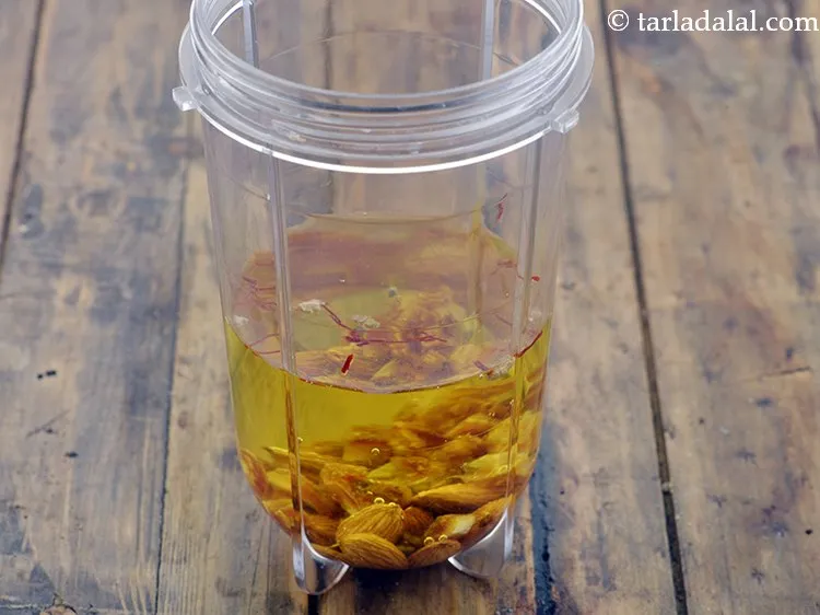 Step 7 – Add &frac34; cup of cold water to get the perfect consistemcy of the<strong> kesar badam …