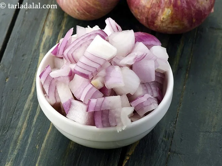 Step 11 – When the seeds crackle, add the onions.&nbsp;
