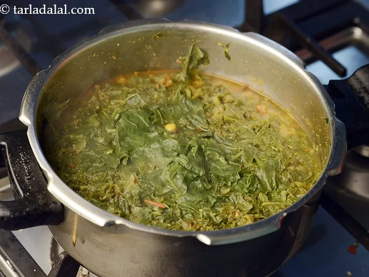 Step 26 – Close the lid of the pressure cooker and pressure cook for 2 whistles. Allow the …