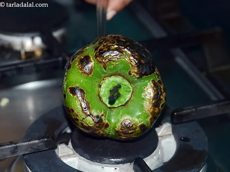 स्टेप 3 – कांटे से छेद करें और खुली आंच पर रखें और …