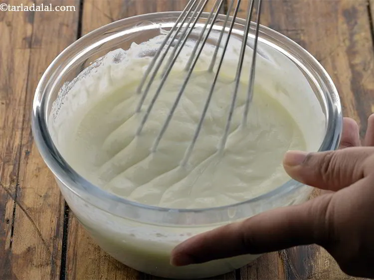 Step 3 – Whisk the curd till it is smooth.