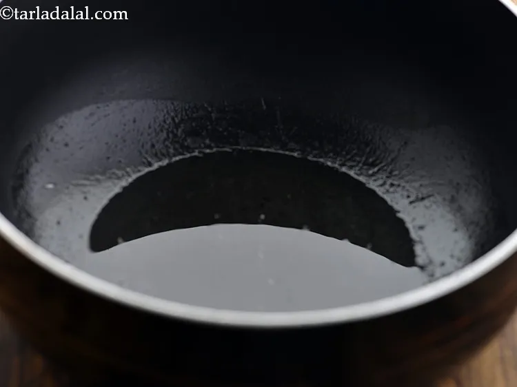 Step 47 – <p>For making the&nbsp;<strong>Sambar</strong>&nbsp;recipe, heat the oil in a deep non-stick pan.</p>