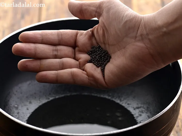 Step 48 – <p>Once the oil is hot, add mustard seeds.</p>