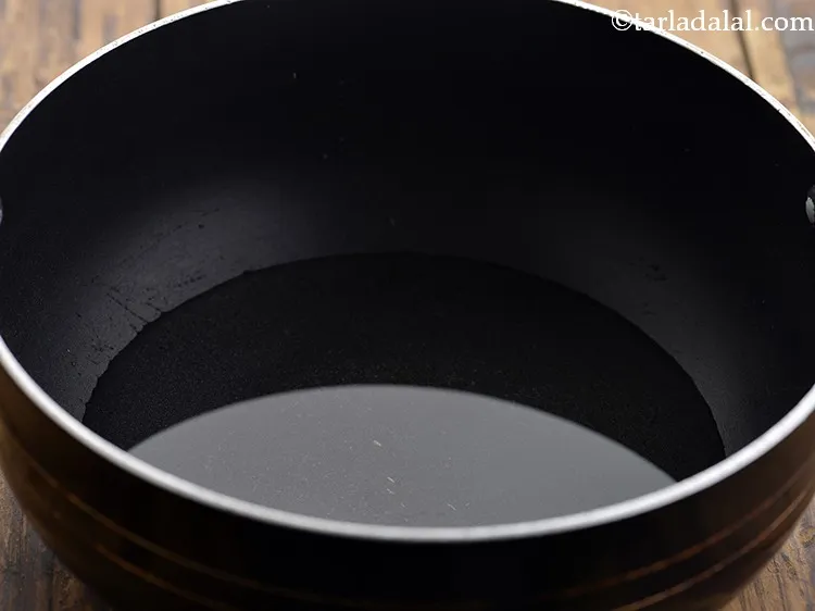 Step 41 – Take 1 cup of water in a deep non-stick pan and bring it to boil.