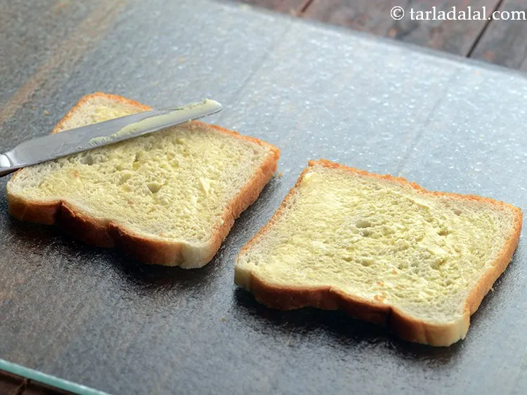 Step 11 – Apply 1 tsp butter on each bread slice.