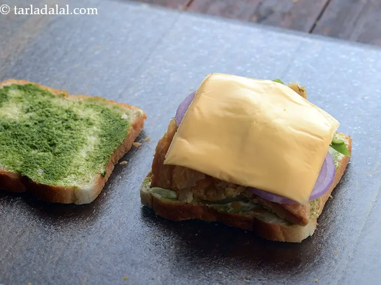 Step 18 – Place a cheese slice carefully over the samosa sandwich. If you don&rsquo;t have cheese slice …