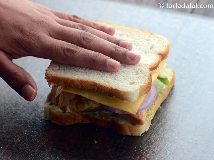 Step 21 – Press it lightly so the chips also get crushed and our <strong>samosa chips sandwich</strong> is …