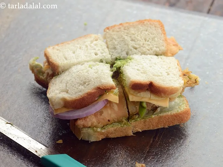 Step 22 – Cut the&nbsp;<strong>samosa chips sandwich | samosa sandwich | street style samosa chips sandwich |</strong>&nbsp;into 4 …