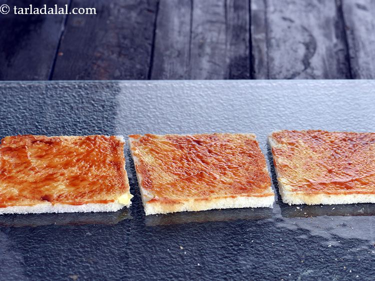 Step 41 – From the 5 buttered bread slices, place 3 bread slices on a clean, dry surface …