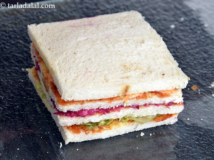 Step 47 – Finally cover it with the fourth bread slice with the buttered side facing downwards and …