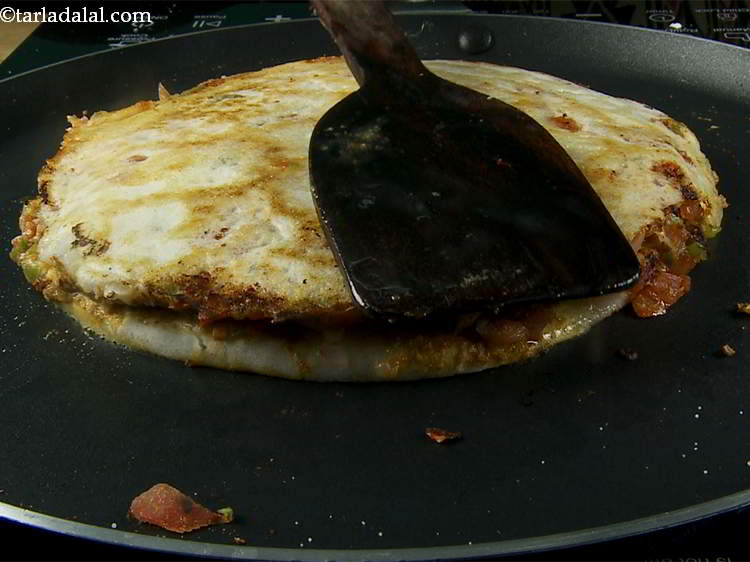 Step 25 – Turnover once again and again cook on a medium flame for 1 minute till it …