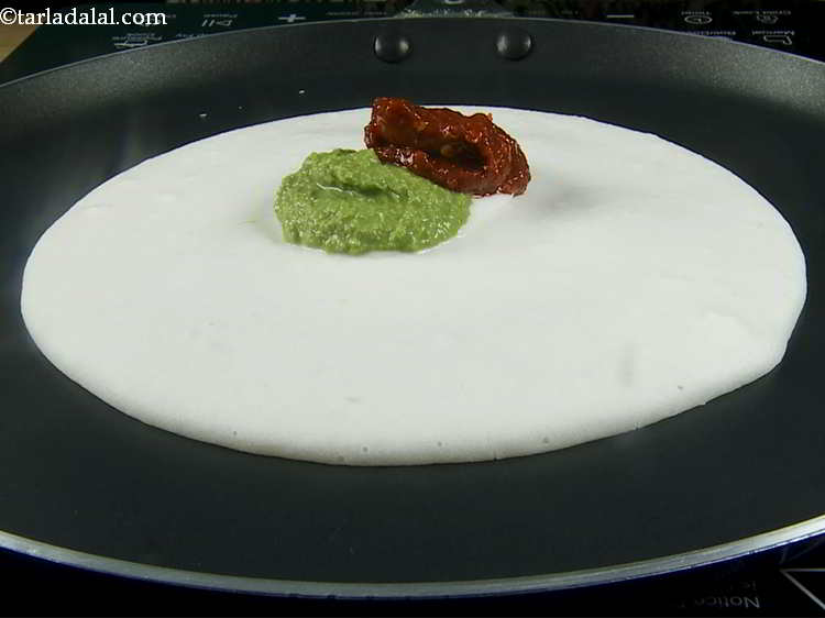 Step 9 – Place 2 tsp of red chutney over it. This is garlic and Kashmiri red chilli …