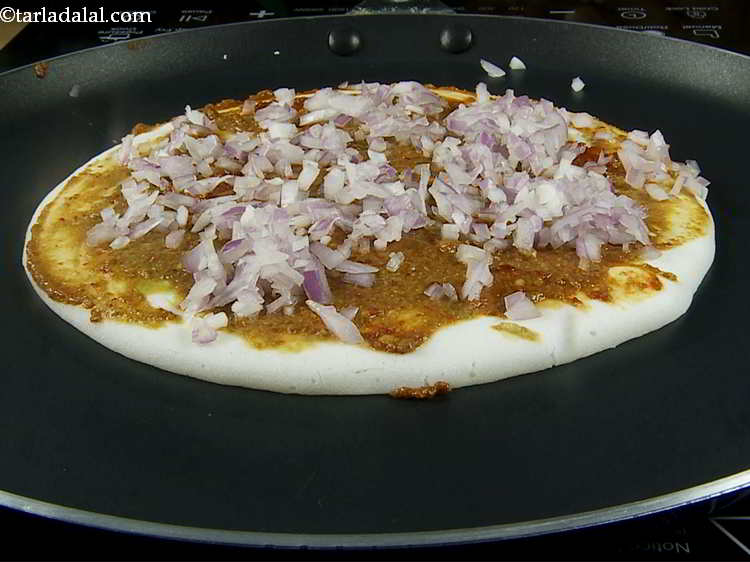 Step 12 – Spread &frac14; cup of onions evenly over it.