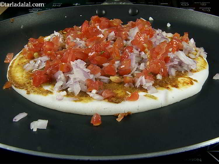 Step 13 – Follow it by spreading &frac14; cup of tomatoes over it. They lend a juicy and …