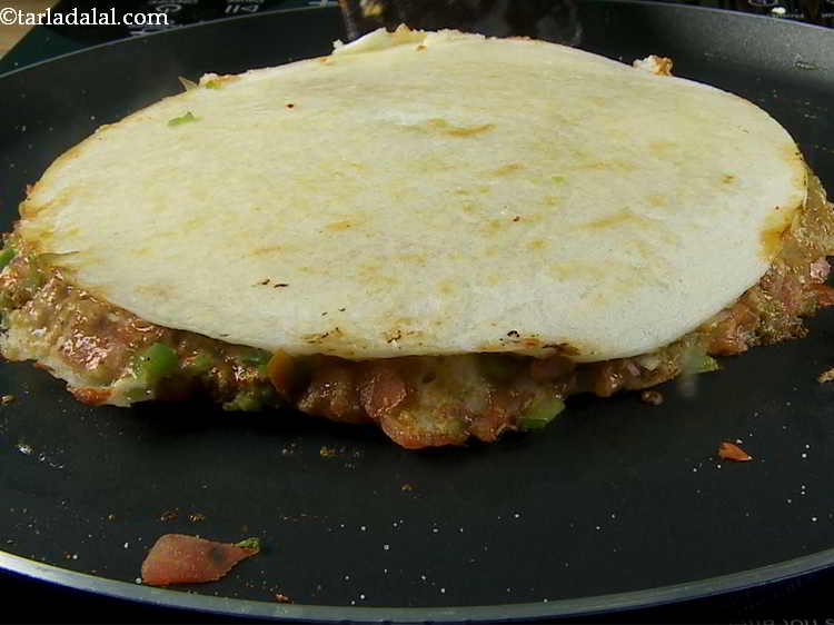 Step 22 – Turnover, tap gently and cook on a medium flame for 3 to 4 minutes till …