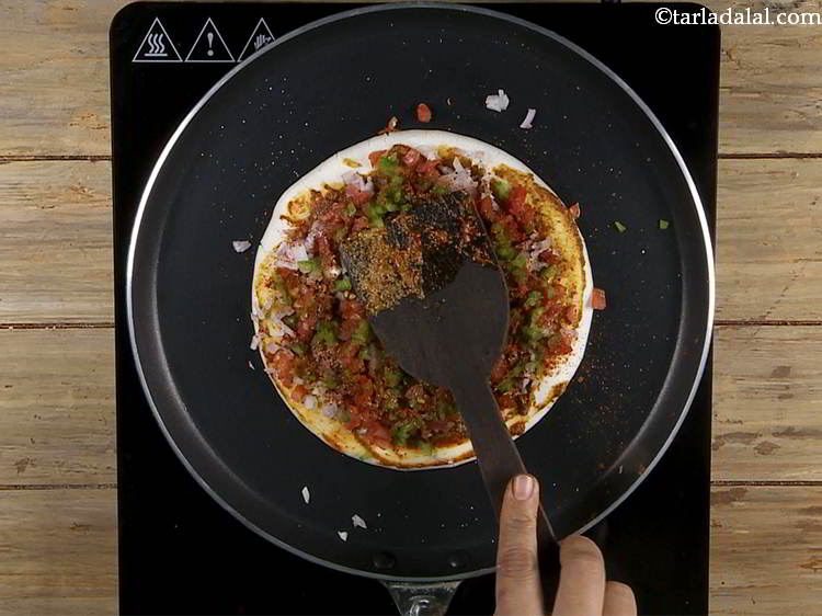 Step 36 – Be very quick in making this uttapam sandwich. Once you spread the veggies, ensure to …