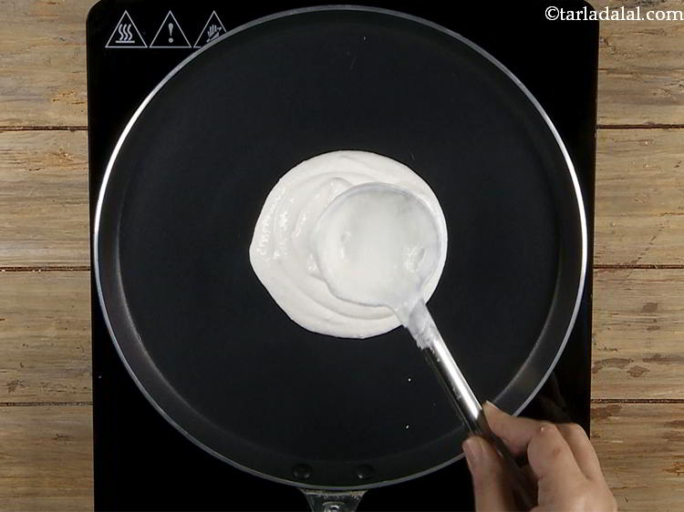 Step 5 – Pour &frac12; cup of the dosa batter on the tava. This is approximately 2 ladleful. …