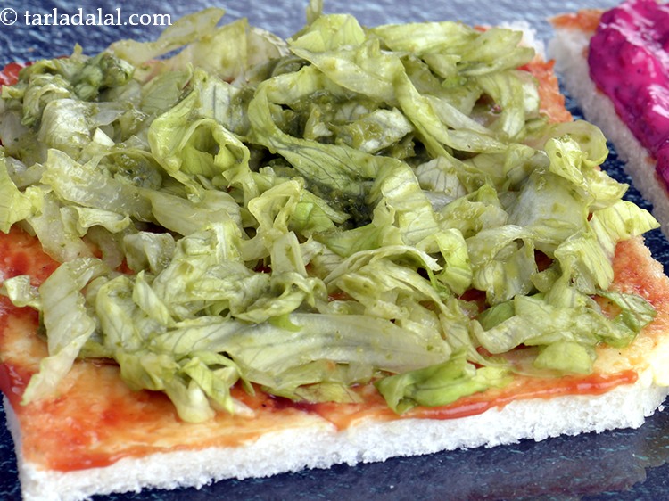 Step 42 – On one of the 3 bread slices, spread one portion of the lettuce mixture.