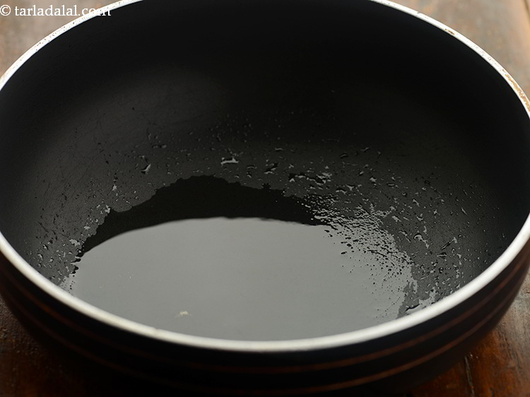 Step 17 – To make <strong>sarson ka saag</strong>, heat the oil in a non-stick kadhai. Traditionally, <strong>Sarson ka …