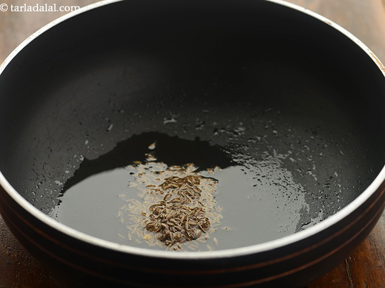 Step 18 – Once the oil is hot, add the cumin seeds.