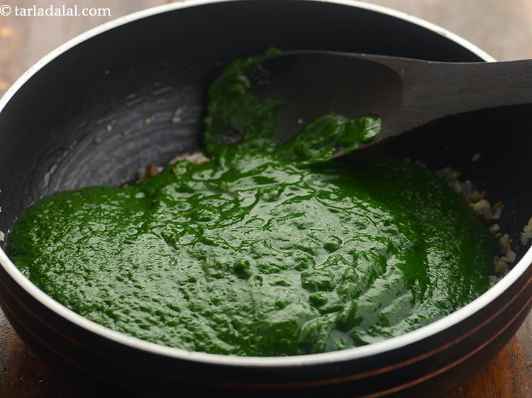 Step 24 – Add the mustard leaves-spinach mixture.
