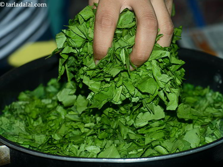Step 8 – Add spinach leaves. It is added to cut the bitterness and balance the extreme pungency …
