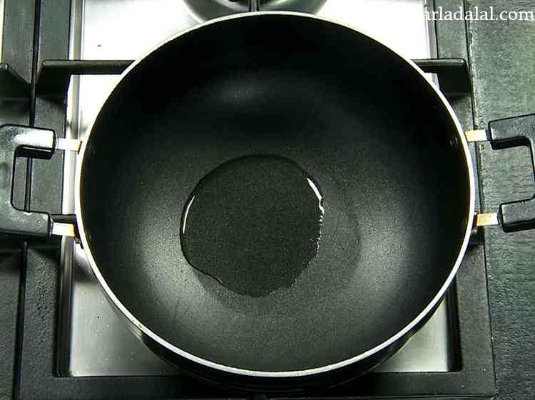 Step 15 – Take another deep non-stick pan and heat some oil in it.