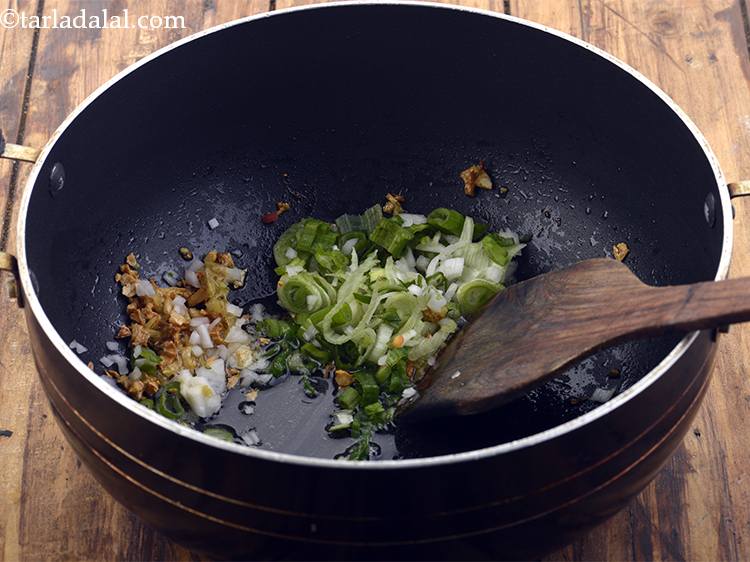 Step 17 – Add the spring onions. We have used both whites and greens as they give a …