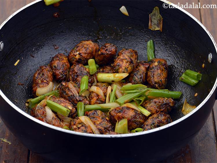 Step 19 – Switch off the flame, add the spring onion greens to&nbsp;<strong>schezwan fingers | veg schezwan fingers …