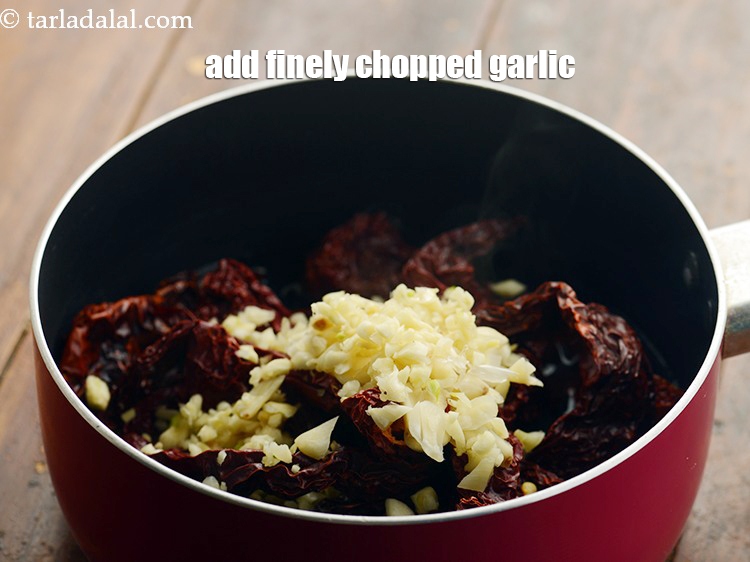 Step 5 – Add 1/4 cup&nbsp;<a href="https://www.tarladalal.com/glossary-chopped-garlic-790i">chopped garlic (lehsun)</a>.&nbsp;