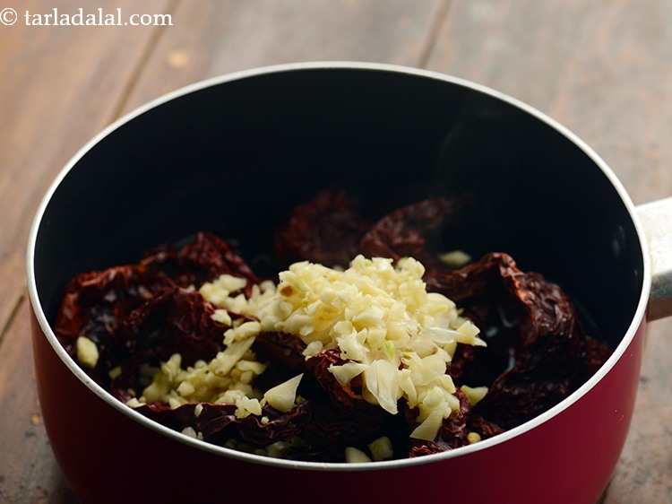 Step 6 – Add the garlic. Peel and roughly chop them before adding.