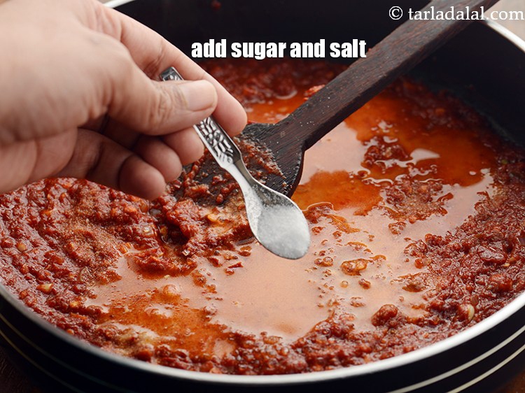 स्टेप 23 – चीनी और नमक डालें। तीखापन को कम करने के लिए …