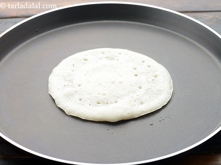 Step 32 – Do not cook the set dosa on both the sides, just one side.&nbsp;