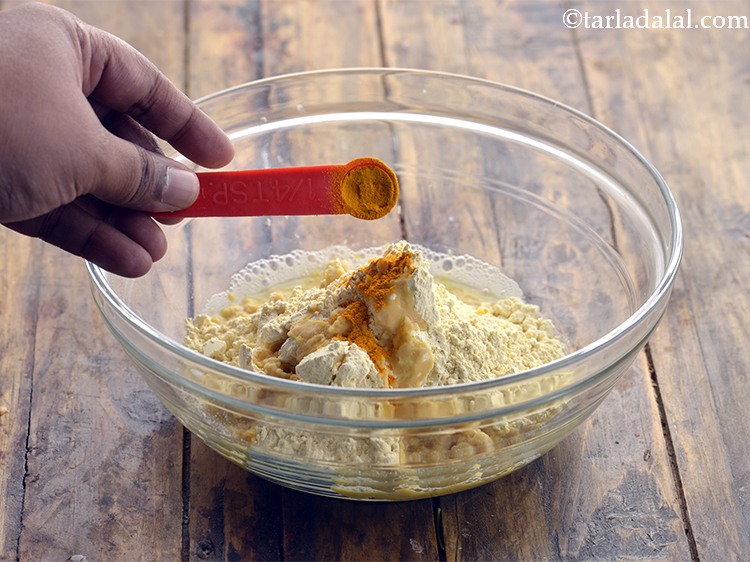 Step 18 – Add turmeric powder. Learn <a href="https://www.tarladalal.com/sev-2791r" target="_blank"><strong>how to make sev at home</strong></a> in detail.<br /> …