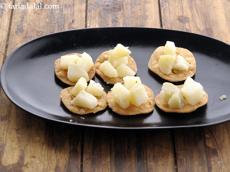 Step 6 – Top each papdi with a few potato cubes. If you are Jain, top it with …