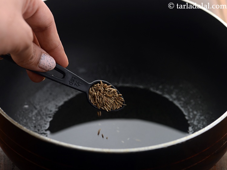 Step 3 – Once the oil is hot, add the cumin seeds.