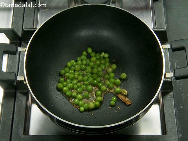 Step 7 – Add the green peas.