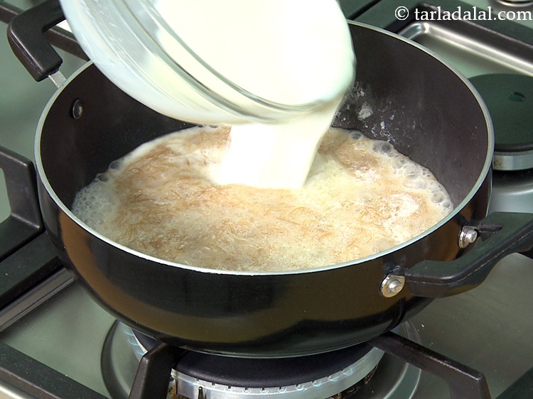 Step 17 – Add remaining 1 3/4 cups of hot&nbsp;<a href="https://www.tarladalal.com/glossary-milk-doodh-full-fat-milk-buffalo-milk-full-cream-milk-514i">milk</a>.