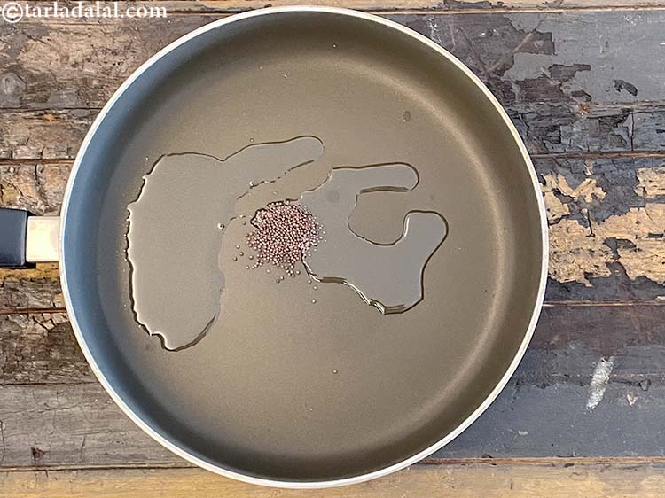Step 6 – <meta charset="UTF-8" /> Add 1/2&nbsp;tsp&nbsp;<a href="glossary-mustard-seeds-sarson-rai-sarson-ke-beej-525i">mustard seeds ( rai / sarson)</a>.