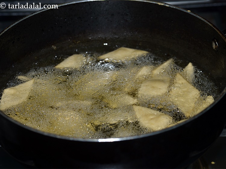 Step 20 – For frying the <strong>shankarpali</strong>, heat the ghee in a deep non-stick kadhai and deep-fry the …