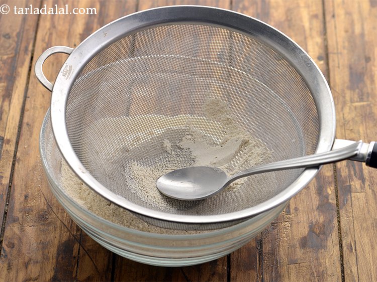 Step 9 – Sift together with the help of a strainer. This breaks down the lumps from flour, …