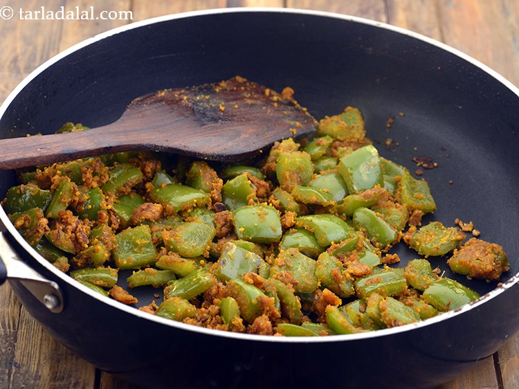 Step 24 – Mix well and cook on a medium flame for 2 minutes, while stirring occasionally.