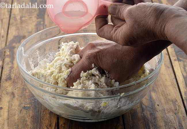 Step 26 – Add water little by little. We will need approximately&nbsp;&frac12; cup of water.