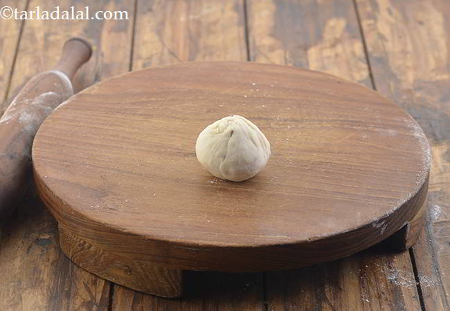 Step 30 – Take a portion of the dough and form it into a ball.