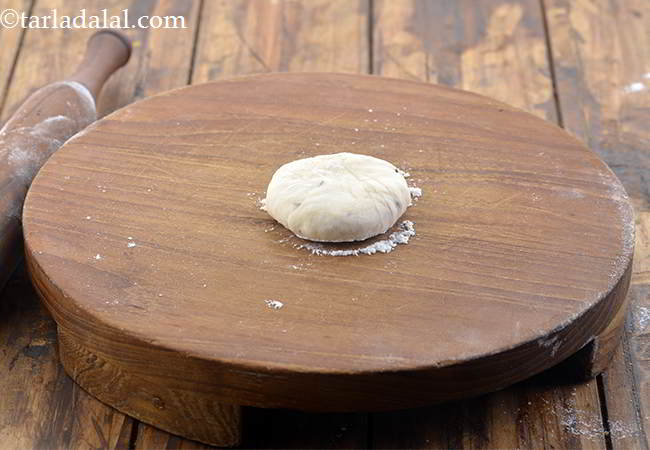 Step 31 – Flatten the dough on the rolling board.